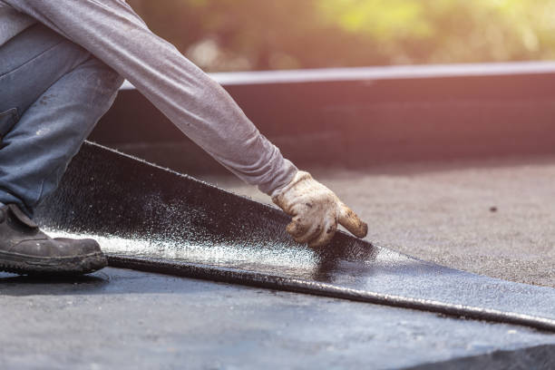 Professional Emergency Waterproofing technician working in Urbana, IL